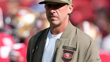 Kyle Shanahan 49ers 2025 Salute To Service Jacket in How to Choose the Right Size NFL Jersey (Nike Edition)