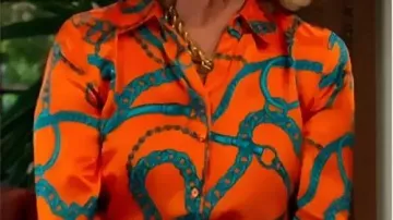Orange Chain Print Blouse worn by Nikki Reed Newman (Melody Thomas Scott) in TV Series The Young And The Restless 2025