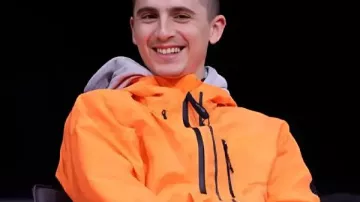 Timothée Chalamet Marty Supreme Orange Tracksuit worn by Marty (Timothée Chalamet) as seen in Marty Supreme