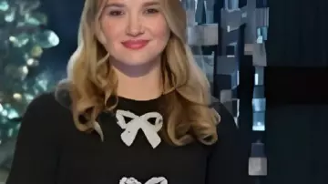 Black Embellished Bow Dress worn by Self - Judge (Melissa Peterman) as seen in Finding Mr. Christmas (S02E05)