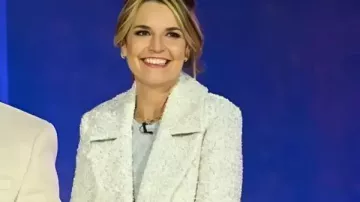 Christmas In Rockefeller Center 2025 Savannah Guthrie White Long Coat worn by Savannah Guthrie in Reba McEntire, Rockettes & Starry Performances At Rockefeller Christmas Tree Lighting | No Intervals