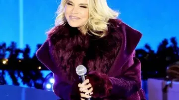 Christmas In Rockefeller Center 2025 Kristin Chenoweth Purple Coat worn by (Kristin Chenoweth) in Christmas in Rockefeller Center 2025