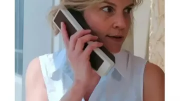 Pluribus 2025 Rhea Seehorn Sleeveless White Shirt worn by Carol Sturka (Rhea Seehorn) in Pluribus (S01)