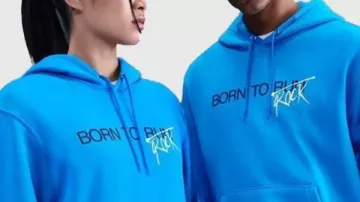 Stranger Things Le sweat à capuche bleu SQWK Stranger Things : Le Droit Visible