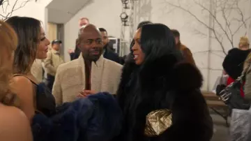 Bottega Veneta Gold Metallic Woven Beauty Pouch worn by Tricia Lee as seen in Owning Manhattan (S02E07)