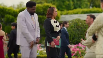 Valentino Garavani Rockstud V-Flap Pouch Clutch Bag worn by Molly Novak (Maya Rudolph) as seen in Loot (S03E10)