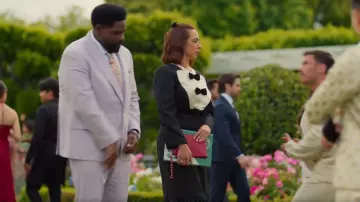 Valentino Garavani Rockstud V-Flap Pouch Clutch Bag worn by Molly Novak (Maya Rudolph) as seen in Loot (S03E10)