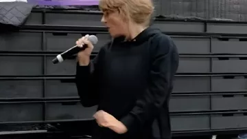 The End of an Era Taylor Swift Black Hoodie worn by Self (Taylor Swift) as seen in Taylor Swift | The Eras Tour | The End of an Era (S01)