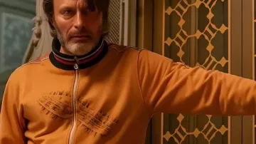 Dust Bunny 2025 Mads Mikkelsen Orange Jacket (Mads Mikkelsen) as seen in Dust Bunny