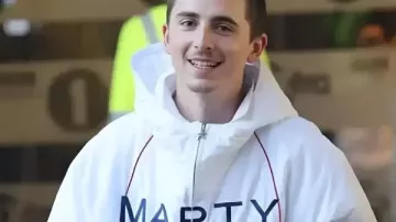 Timothee Chalamet London White Marty Supreme Jacket worn by Marty (Timothée Chalamet) as seen in Marty Supreme