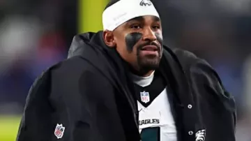 Jalen Hurts Philadelphia Eagles Black Cape Coat worn by Jalen Hurts in The Philadelphia Eagles might’ve FINALLY solved this issue at the PERFECT time…