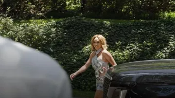 Cult Gaia Caldera Metallic Clutch Bag worn by Ashley Darby as seen in The Real Housewives of Potomac (S10E11)