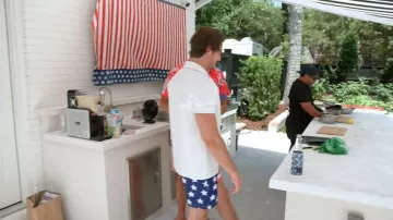 Kanu Surf Stars & Stripes Swim Trunks Board Shorts Red worn by Craig Conover as seen in Southern Charm(S11E05)