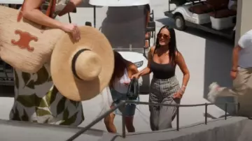 Bottega Veneta The Pouch Leather Clutch worn by Lisa Barlow as seen in The Real Housewives of Salt Lake City (S06E14)