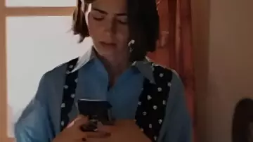 Emily In Paris S05 Lily Collins Blue Shirt With Polka Dot Tie worn by Emily Cooper (Lily Collins) as seen in Emily in Paris (S05)
