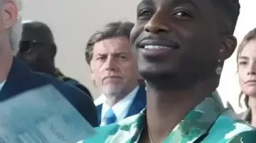 Green AfroCamo Jacket worn by Julien (Samuel Arnold) as seen in Emily in Paris (S05)