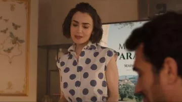 Moschino Biro Polka Dots Poplin Top worn by Emily Cooper (Lily Collins) as seen in Emily in Paris (S05E04)