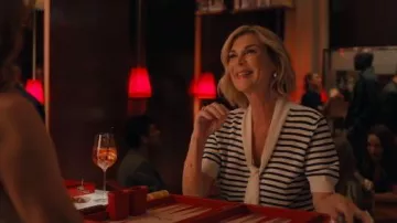 Frame The Sailor Striped Tie Neck Sweater worn by Yvette (Michèle Laroque) as seen in Emily in Paris (S05E06)