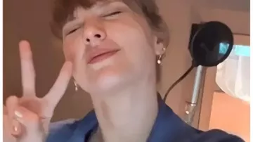 The End Of An Era 2025 Taylor Swift Blue Jacket worn by Self (Taylor Swift) as seen in Taylor Swift | The Eras Tour | The End of an Era (S01E01)