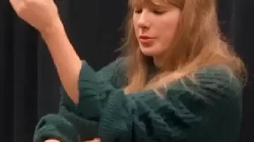 Taylor Swift Green Knitted Sweater Dress worn by Self (Taylor Swift) as seen in Taylor Swift | The Eras Tour | The End of an Era (S01E01)