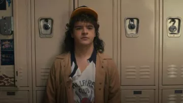 Trevor Girard Hellfire Club Raglan T-Shirt esigned worn by Dustin Henderson (Gaten Matarazzo) as seen in Stranger Things (S05E01)