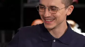 Marty Supreme Timothée Chalamet Black Polo Shirt worn by Marty (Timothée Chalamet) as seen in Marty Supreme