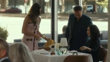 Cult Gaia Nala Mini Pleated Metallic Leather Clutch Bag worn by Bella (Stefania Spampinato) as seen in Landman (S02E04)