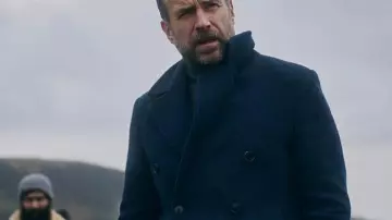 Rafe Spall Under Salt Marsh 2026 Blue Coat of Eric Bull (Rafe Spall) in Under Salt Marsh (S01E01)