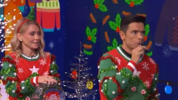 Tipsy Elves Deck the Halls Game Ugly Christmas Sweater worn by Kelly Ripa as seen in LIVE with Kelly and Mark on December 19, 2025