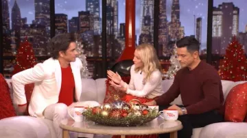 McQueen Crystal Rose Wool Sweater worn by Kelly Ripa as seen in LIVE with Kelly and Mark on December 26, 2025