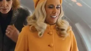 Palm Royale S02 Kristen Wiig Orange Fur Trim Coat worn by Maxine Simmons (Kristen Wiig) as seen in Palm Royale