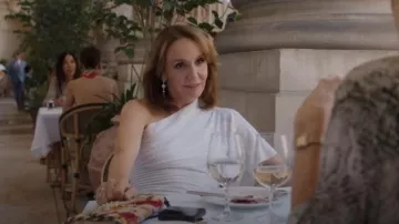 APM Monaco Soleil Longue Earrings worn by Sylvie Grateau (Philippine Leroy-Beaulieu) as seen in Emily in Paris (S05E07)