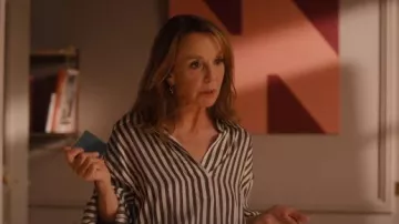Khaite Melan Black and White Striped Blouse worn by Sylvie Grateau (Philippine Leroy-Beaulieu) as seen in Emily in Paris (S05E09)