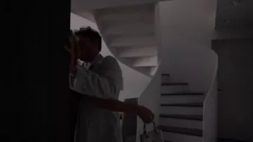 Schiaparelli Mini Face Bag in Silver worn by Sylvie Grateau (Philippine Leroy-Beaulieu) as seen in Emily in Paris (S05E09)