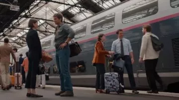 Eastpak Tranzshell Carrier 55L worn by Livia Muratori as seen in Emily in Paris (S05E09)