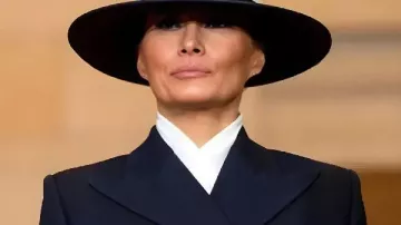 Melania Trump 2026 Black Long Coat in Former friend and aide explains Melania Trump's 'I don't care' jacket