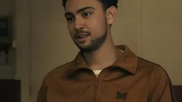 Steal 2026 Archie Madekwe Brown Track Jacket worn by Luke (Archie Madekwe) as seen in Steal (S01)