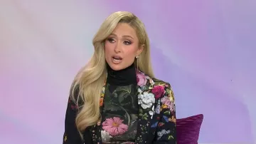 Alice + Olivia Delaina Turtleneck Top in Be Still worn by Paris Hilton as seen in Today with Jenna & Sheinelle  on January 28, 2026