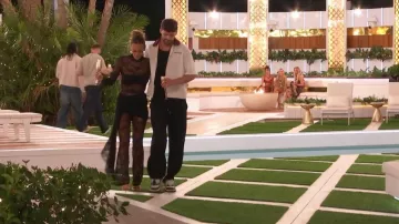 Wanderdoll Roxy Sheer Lace High Neck Drape Waist Detail Wide Leg Jumpsuit worn by Millie Court as seen in Love Island: All Stars (S03E14)