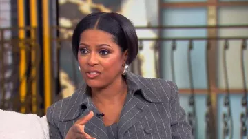 Carolina Herrera Pinstriped Wool-Blend Top worn by Tamron Hall as seen in Tamron Hall Show on January 28, 2026