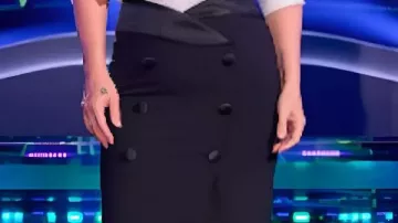 Jupe longue noire à double boutonnage portée par Kelly Clarkson dans l'émission The Voice (saison 29).