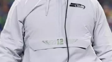 Jacket worn by Russell Wilson in Seattle Seahawks Super Bowl Media Day Shoes????