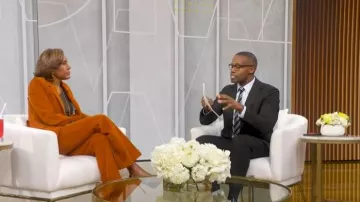 Victoria Beckham High-Rise Flared Corduroy Pants worn by Robin Roberts as seen in Good Morning America on February 17, 2026