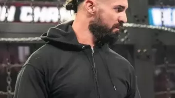 Seth Rollins WWE Elimination Chamber Hoodie of Seth Rollins in Seth Rollins revealed as the masked man: Elimination Chamber 2026 highlights