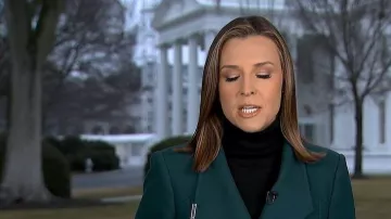 Abrigo largo de cinturón largo de Ted Baker Ellgenic llevado por Mary Bruce visto en Good Morning America el 6 de marzo de 2026
