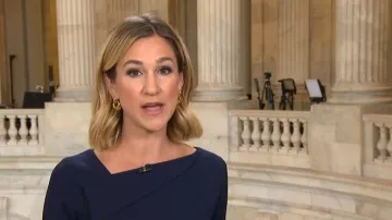 Connected Apparel Asymmetric Neck Sheath Dress worn by Caitlin Huey-burns as seen in CBS Mornings on April 22, 2026
