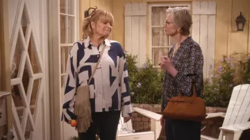 Ann Taylor Chain Link Print V Neck Popover Navy Teal worn by Val (Jane Lynch) as seen in Happy's Place (S02E15)
