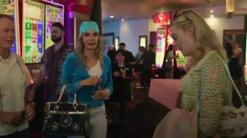 Staud Timmy Floral Beaded Shoulder Bag worn by Margo Millet (Elle Fanning) as seen in Margo's Got Money Troubles (S01E05)
