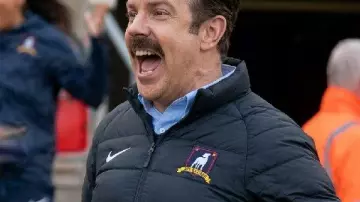 Ted Lasso Puffer Jacket worn by Ted Lasso (Jason Sudeikis) as seen in Ted Lasso (S04)