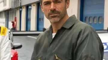 Motorvalley S01 Arturo Benini Grey Jumpsuit worn by Arturo Benini (Luca Argentero) as seen in Motorvalley (S01E06)